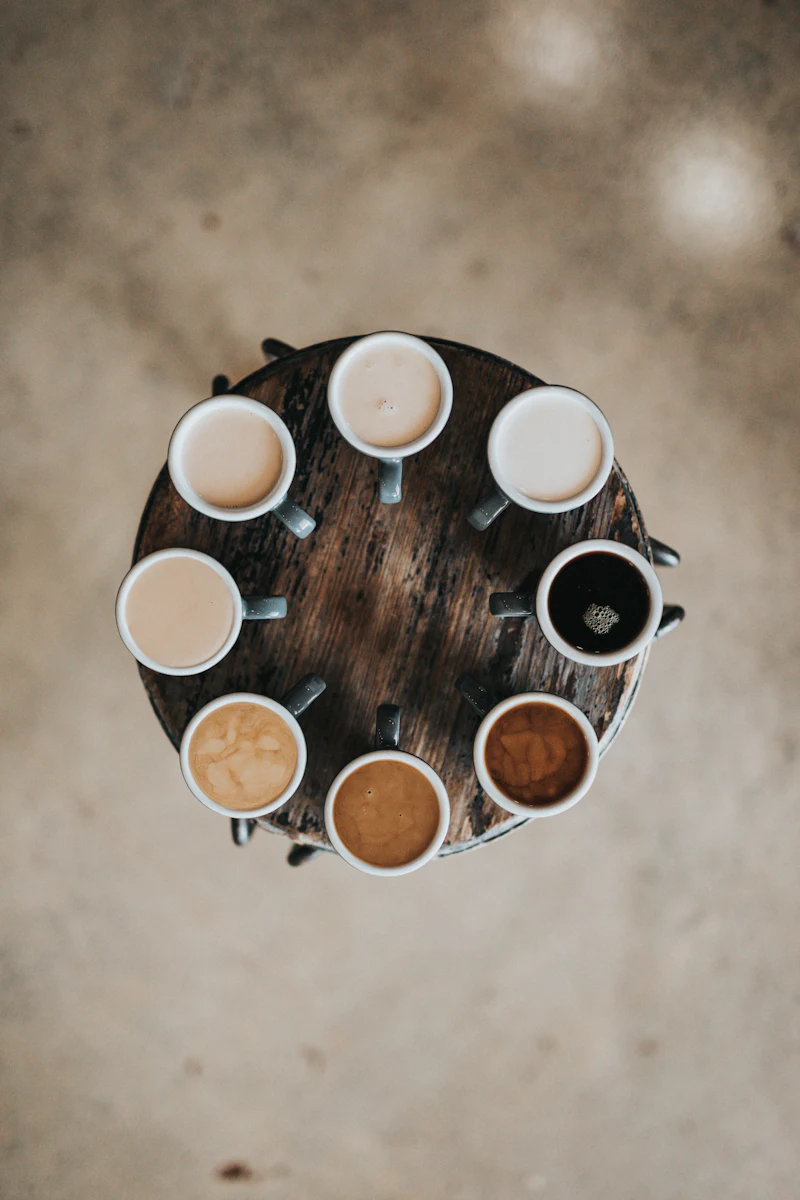 Overhead view of a table full of coffee drinks