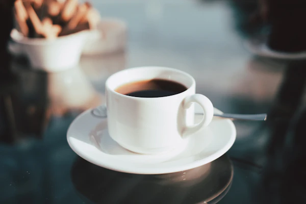 An espresso on a marble café table
